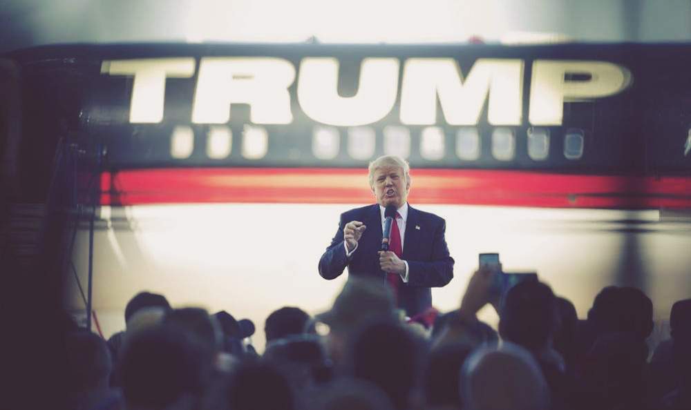 President-elect Donald Trump stands in front of his airplane as he speaks during a rally in Bentonville, Ark. Photo: John Bazemore\/AP Photo