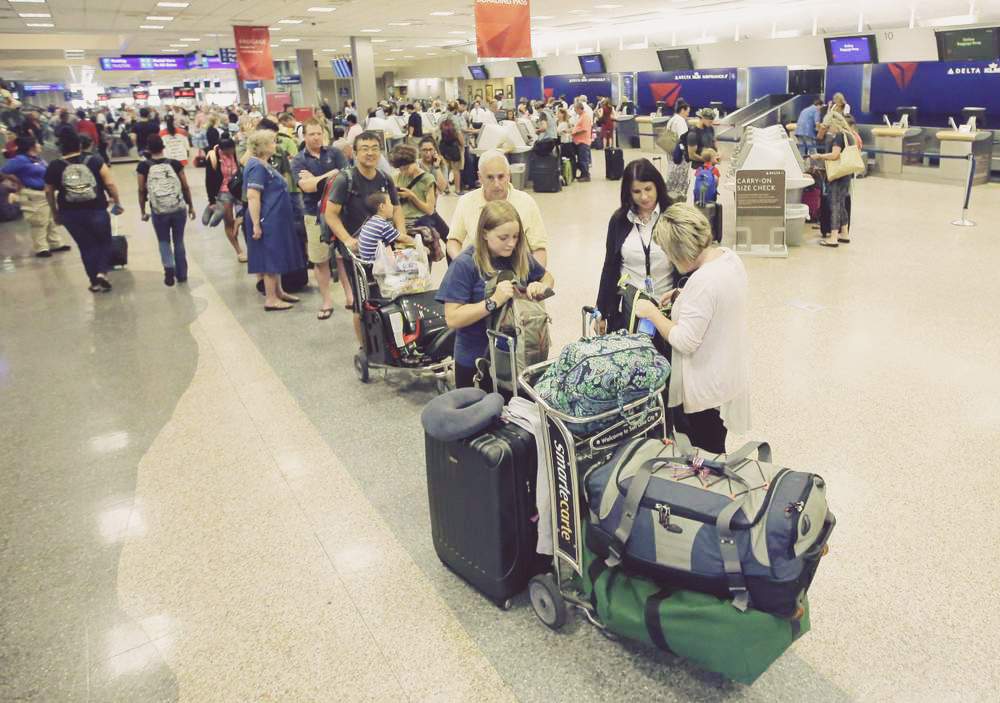 Delta passengers wait Tuesday at Salt Lake City International Airport. Technology failures at multiple airlines revealed legacy issues. Photo: Rick Bowmer/AP Photo