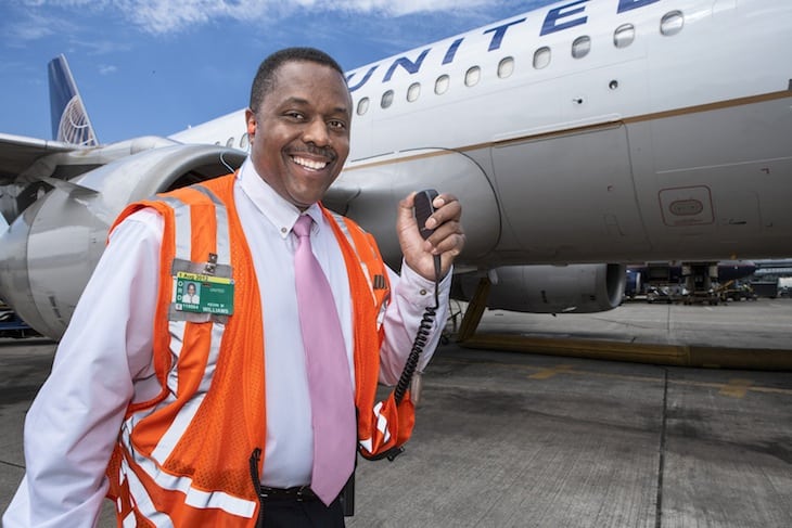 United Airlines ground crew member participating in United Pink Program for breast cancer awareness.