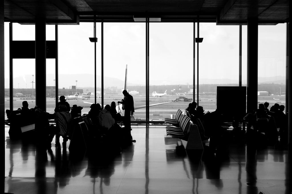 Passengers wait for a flight to to Kenya at Zurich Airport in Switzerland. 