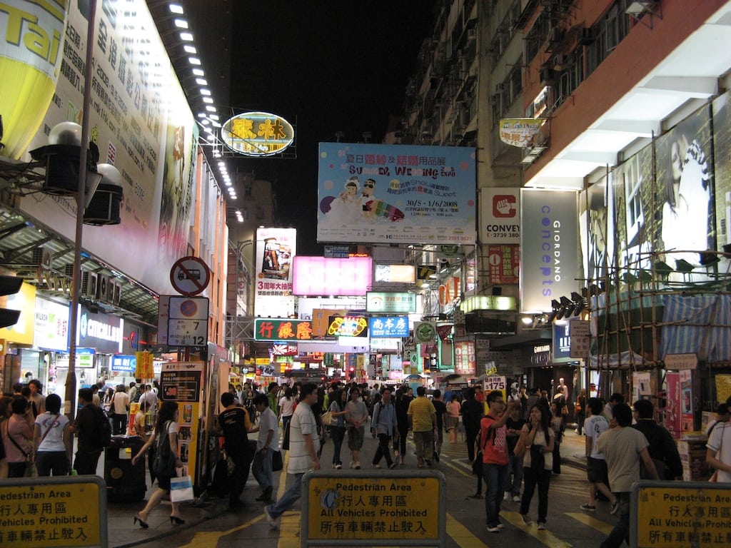 Shoppers fill the street late on a Monday night in Hong Kong. 