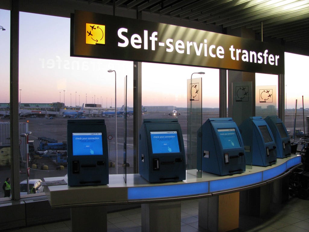 Self-service transfer at Amsterdam Schipol Airport.