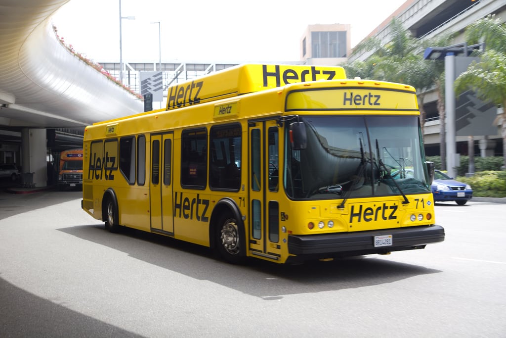 A Hertz car rental shuttle pulls away from Los Angeles International Airport.