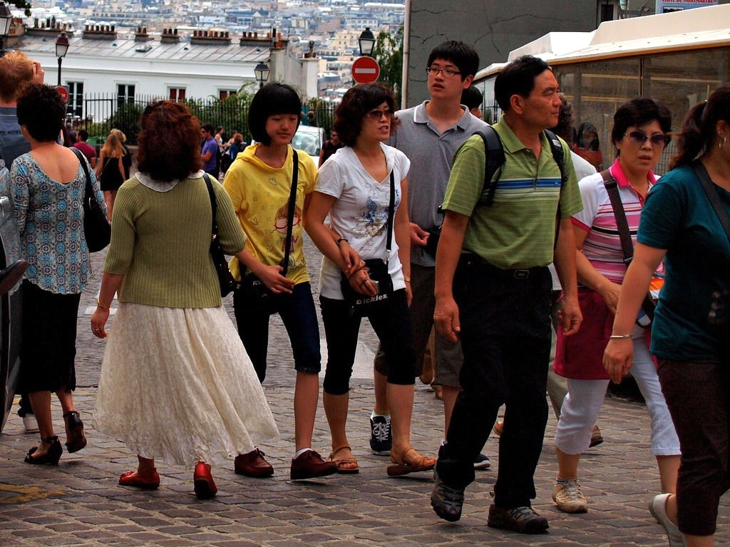 Chinese tourists in the Montmarte neighborhood of Paris, France.