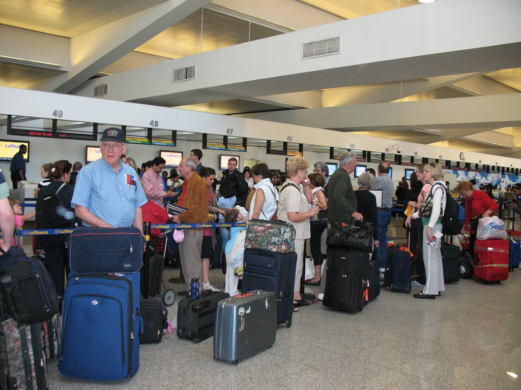 Passengers wait to check bags at a Delta counter at Atlanta International Airport.