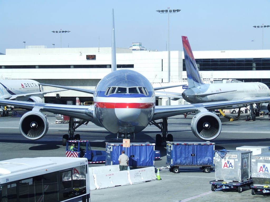 An American Airlines 767 aircraft pushes back from the gate at LAX.