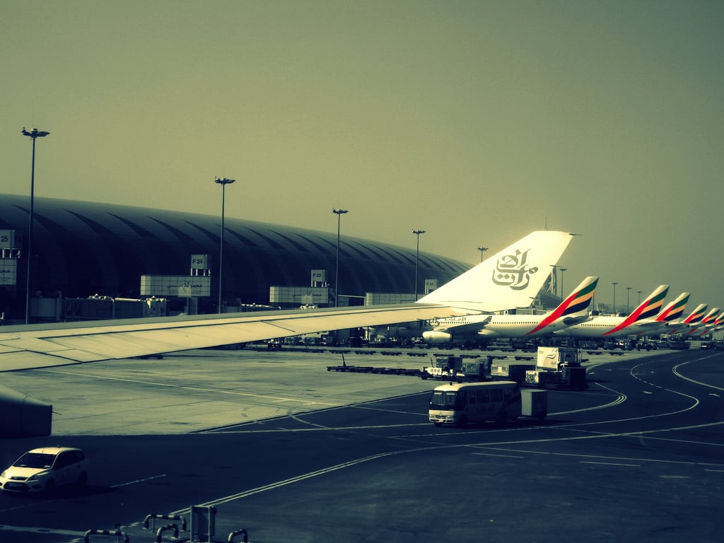 Emirates jets line up outside of Dubai International Airport. 