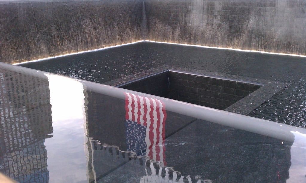 A reflection of the Freedom Tower at the 9/11 Memorial in Manhattan.