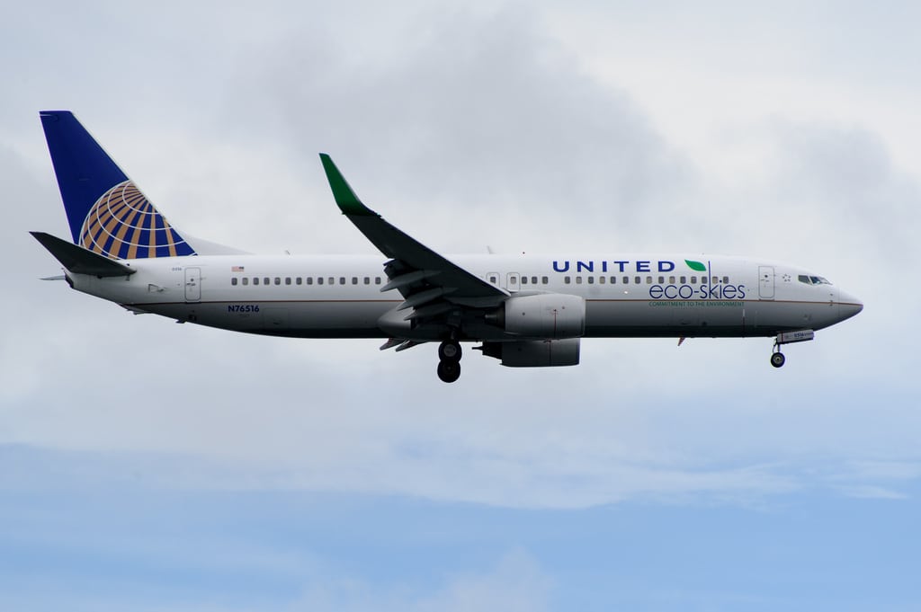 An United Airlines flight lands at Logan International Airport in Boston.