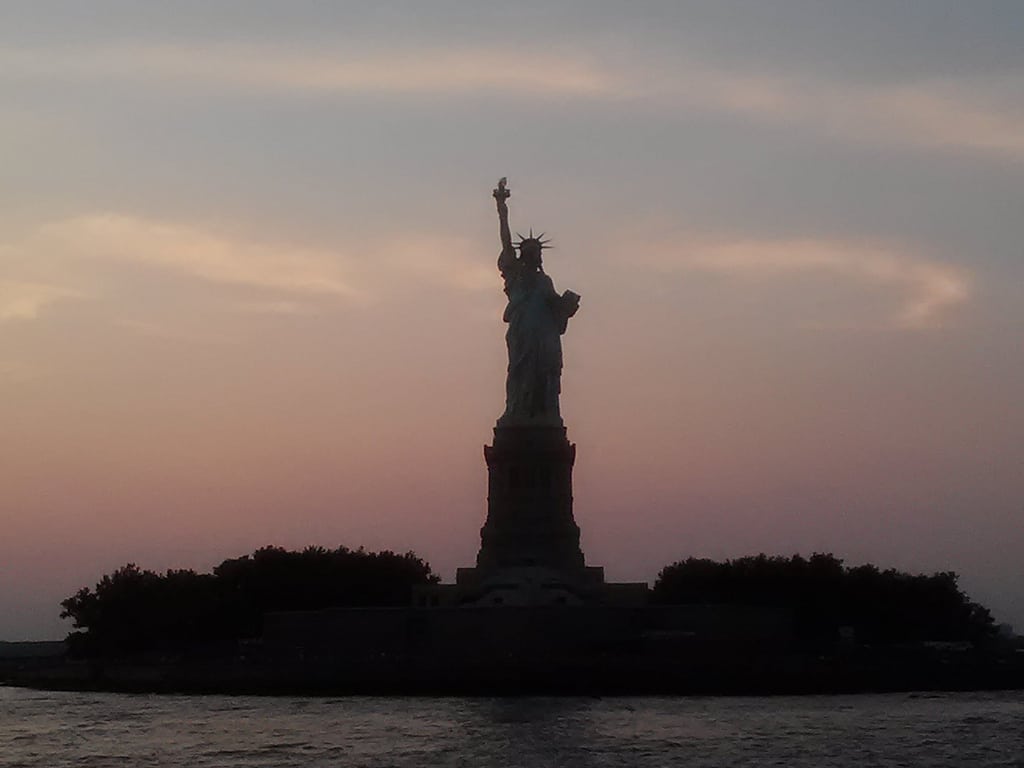Statue of Liberty in New York at sunset.