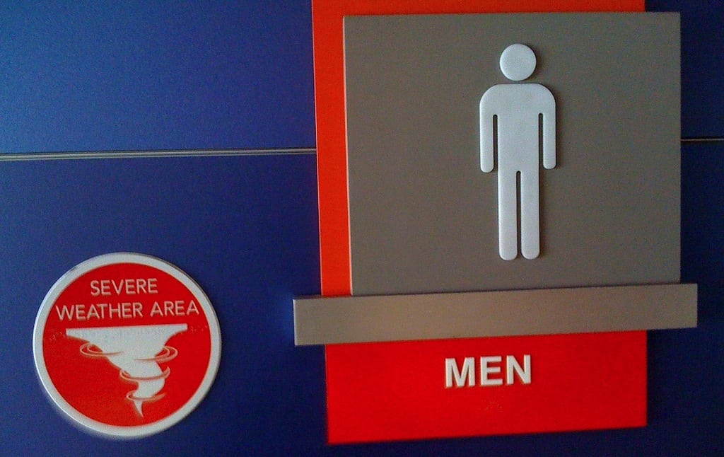Strange bathroom signage at DFW airport in Dallas, Texas. 