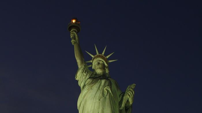 The Statue of Liberty is illuminated for the first time since it was damaged by hurricane Sandy. The statue, one of the city's top tourist attractions, has been closed because of damage resulting from the storm that hit New York Oct. 29. there's currently  no estimate when it will reopen to visitors.
