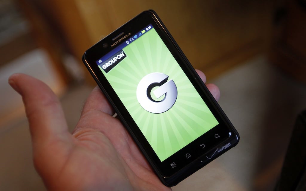 The Groupon smartphone app is displayed on a Motorola Droid Bionic cell phone in Denver November 4, 2011. 