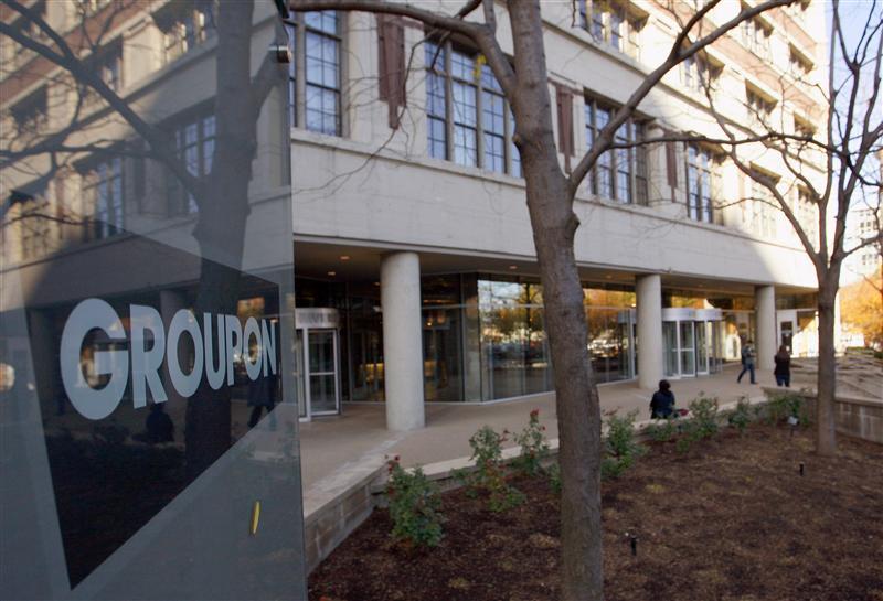 People enter and leave Groupon Inc corporate office and headquarters in Chicago, Illinois, November 4, 2011. 