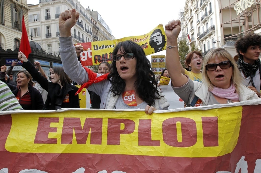 Protesters shout slogans during a demonstration by French labour unions against austerity policies in Europe, in Marseille November 14, 2012. The banner reads, "Employment". 