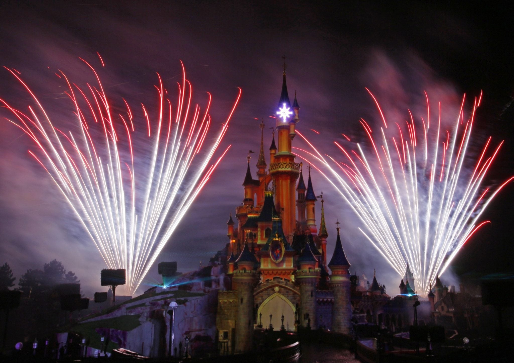 In this March 31, 2012 file photo, a firework display lights up the castle of Sleeping Beauty in Disneyland's theme park in Marne-la-Vallee, east of Paris. 