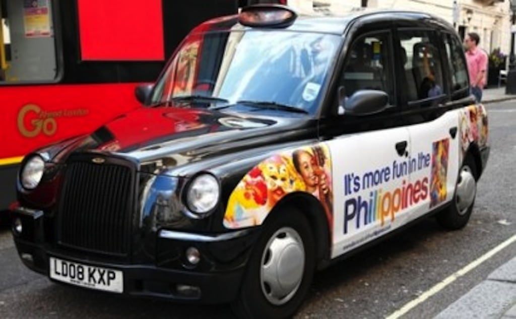 "It's more fun in the Philippines ads" cover London's black taxis. 