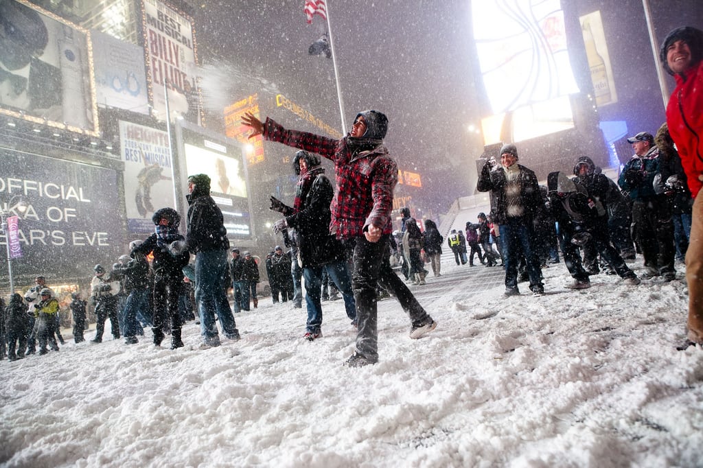 Snowstorm and snowball fight in Times Square, Manhattan, New York.