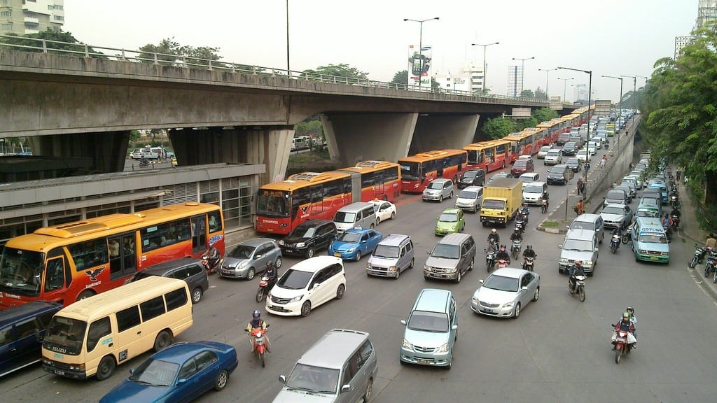 Buses are often stopped on highways in Jakarta due to traffic jams. 