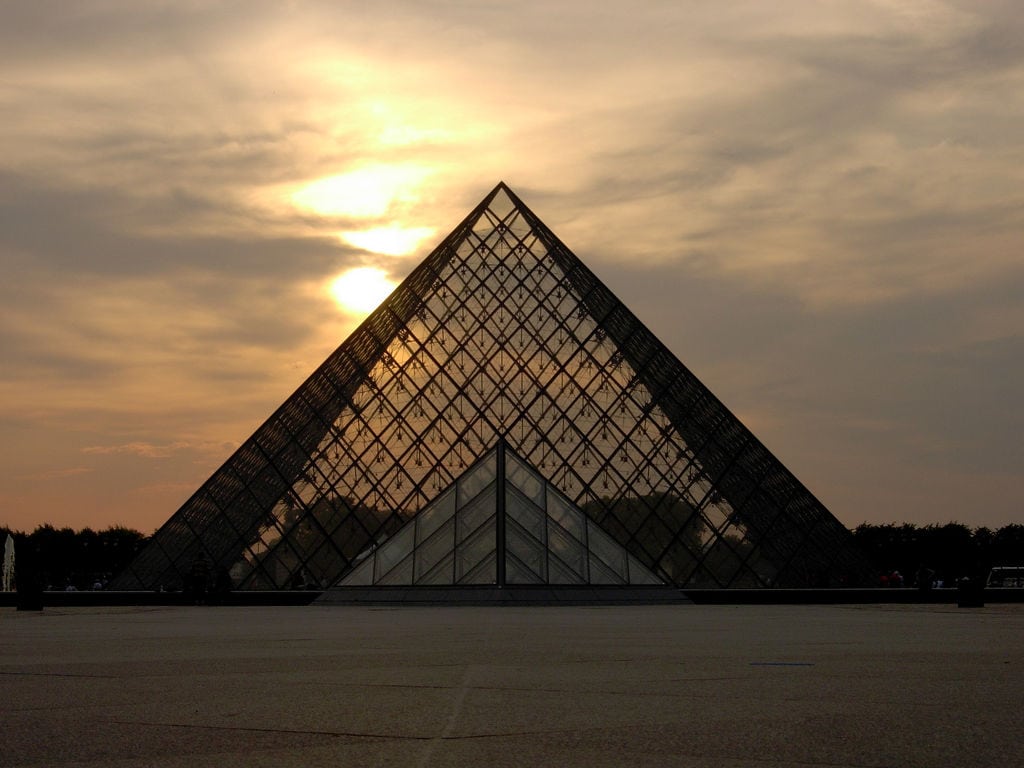 The Louvre Museum at dusk in Paris, France. 