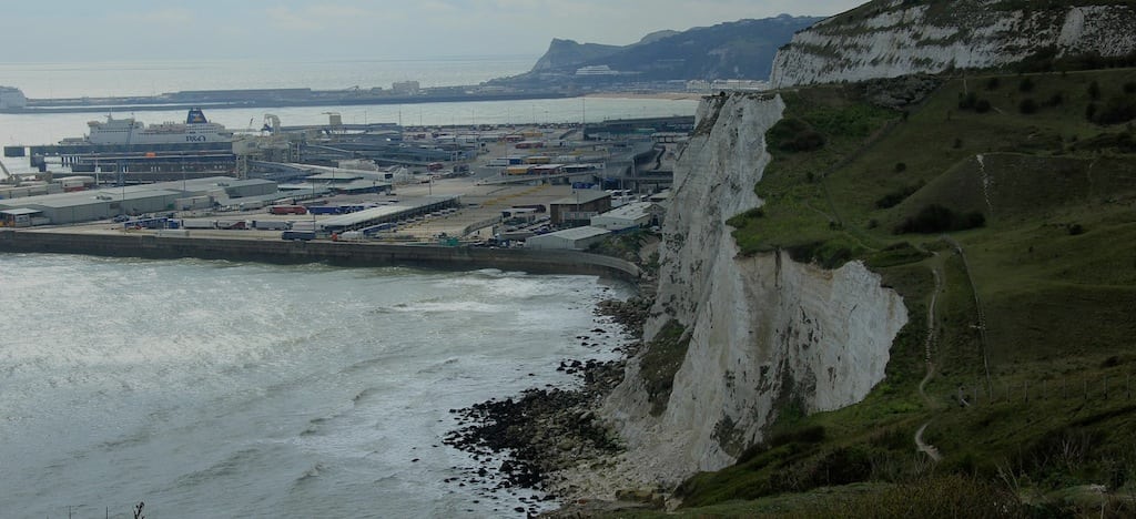 A P&O Princess ship in the background is docked near the White Cliffs of Dover. Parent company Carnival is concerned about another cliff in the U.S. 