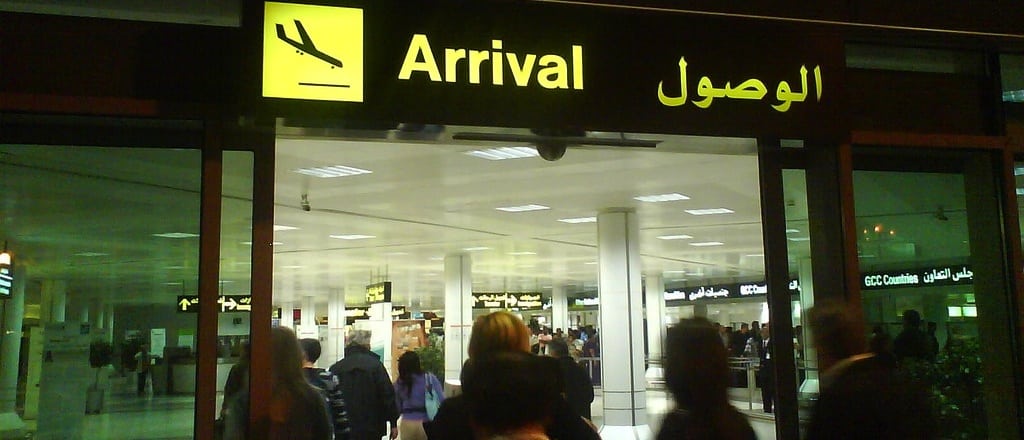 Passengers walk towards Arrivals at Doha International Airport. 