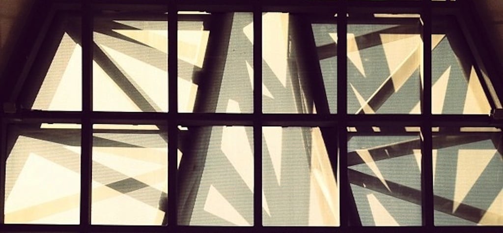 An Instagram photo of the symmetry, angles, and shadows at Suvarnabhumi Airport in Bangkok, Thailand. 
