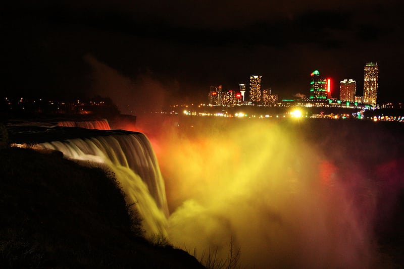 Niagara Falls by night, and the city in the background. 