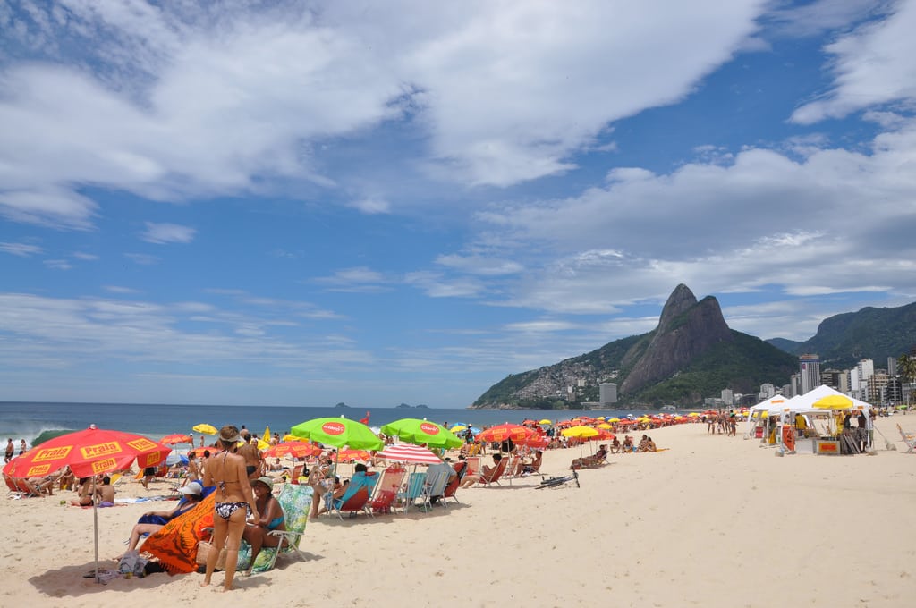 Tourists visit Ipanema Beach in Rio de Janeiro. 