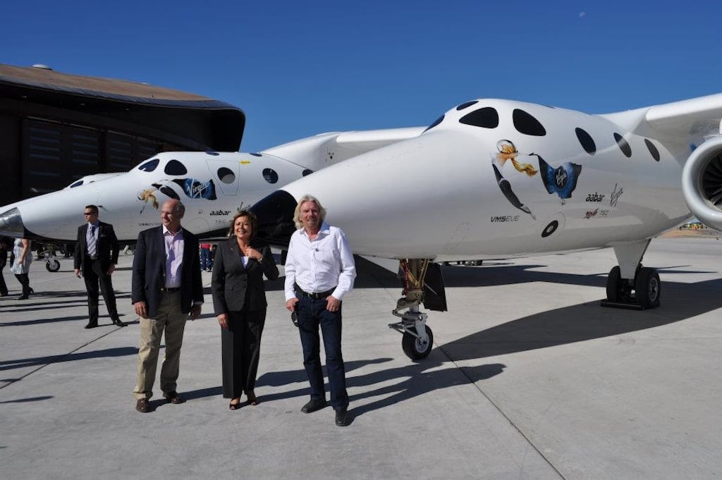 Congressman Steve Pearce, Governor Susana Martinez, and Sir Richard Branson in front of the WhiteKnighttwo.