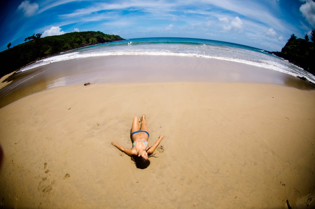 A girl tans in Kauai. 