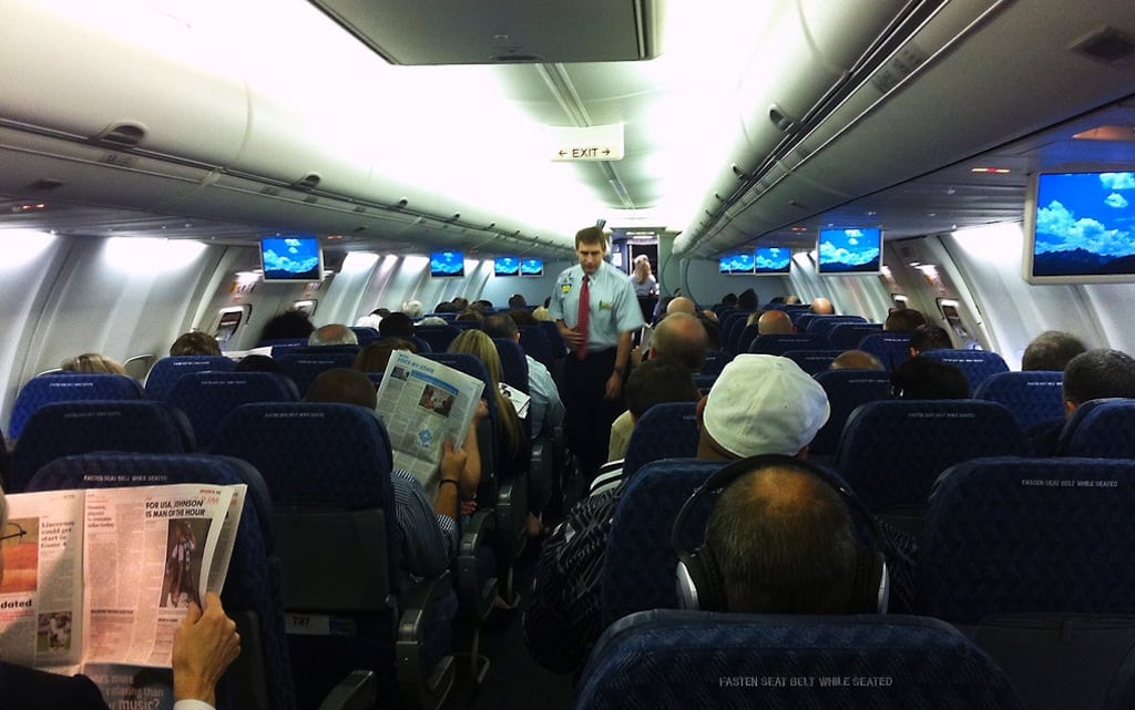 Passengers paid higher domestic fares in the third quarter of 2012. Pictured are passengers in an American Airlines 737. 