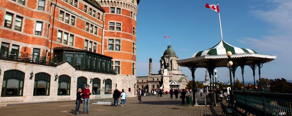 Tourists in front of the Fairmont Le Château Frontenac hotel in Quebec City, Canada. 