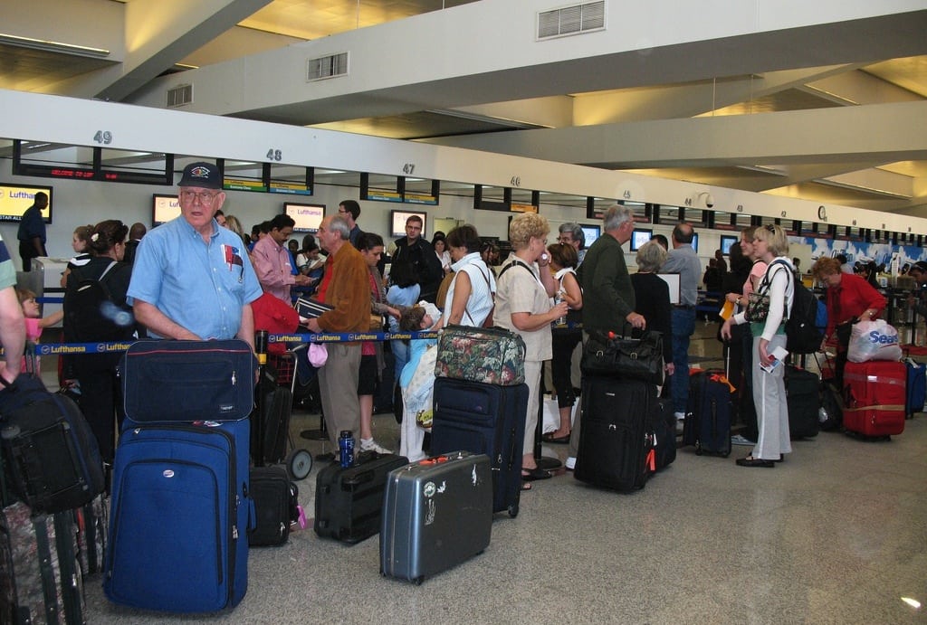 Passengers wait to check their bags at the airport in Atlanta, Georgia. 