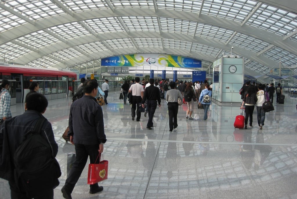 Flyers exit the express train at Terminal 3 of Beijing Capital Airport. 
