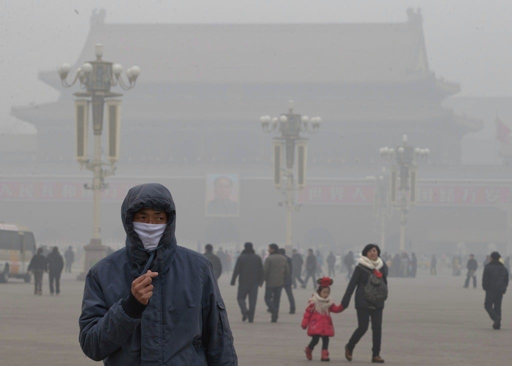 A man wears a mask on Tiananmen Square during a very hazy day in Beijing, China on January 29, 2013. 