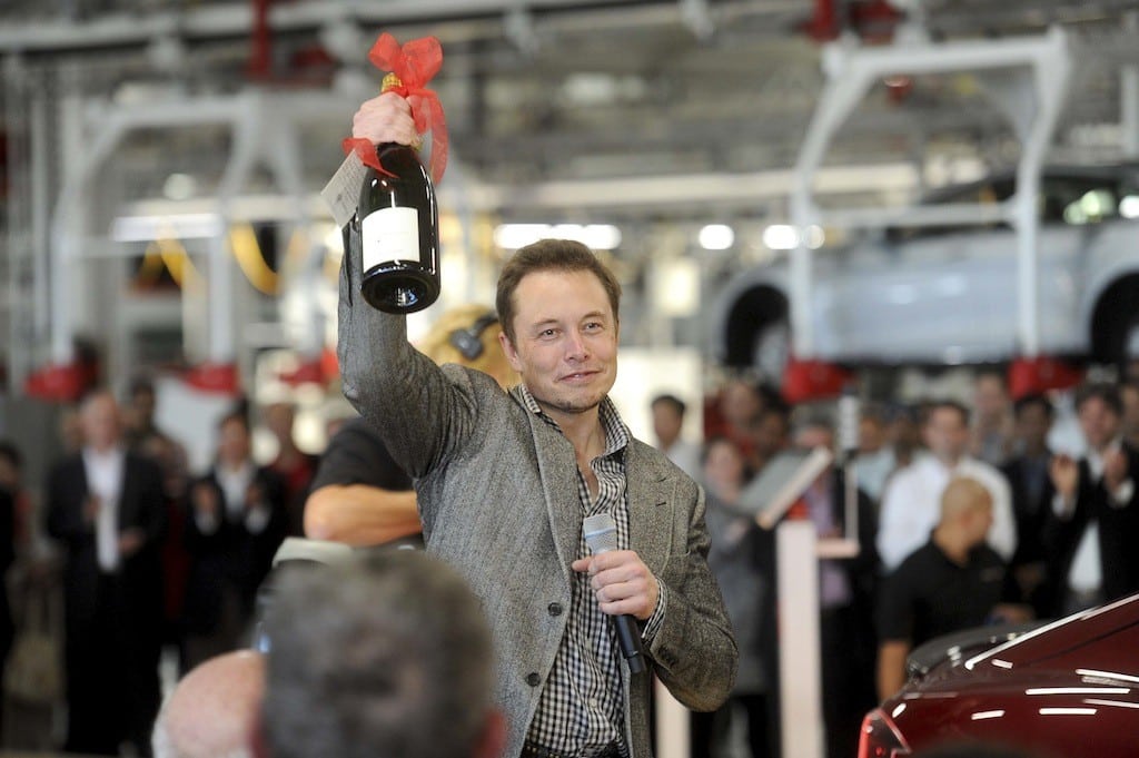 Tesla Chief Executive Office Elon Musk celebrates at his company's factory in Fremont, California, June 22, 2012, as the car company began delivering its Model S electric sedan.   