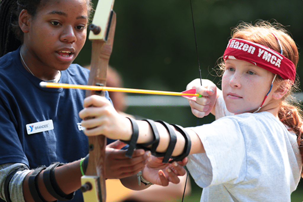 A camper takes an archery lesson at Camp Hazen YMCA in Connecticut. 