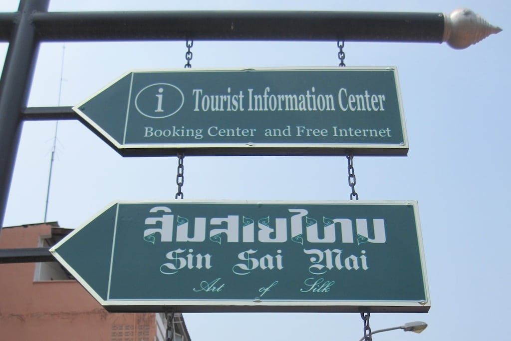 A tourists finds one a street sign with English in Vientiane, Laos.