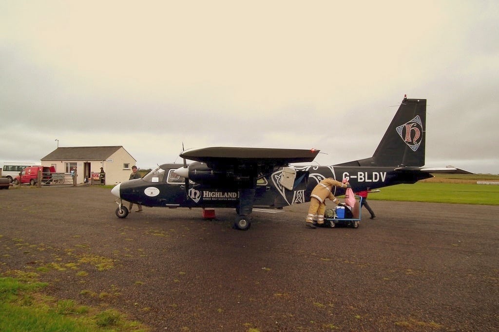 Loganair on Sanday Orkney Island. The airport is in the background. 