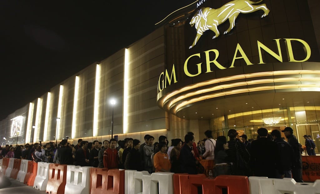 In this Dec. 18, 2007 photo, visitors queue up for entry of the new MGM Grand Macau casino resort after the opening ceremony in Macau. 