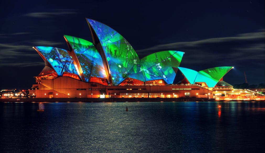 The luminous Sydney Opera House at night. 