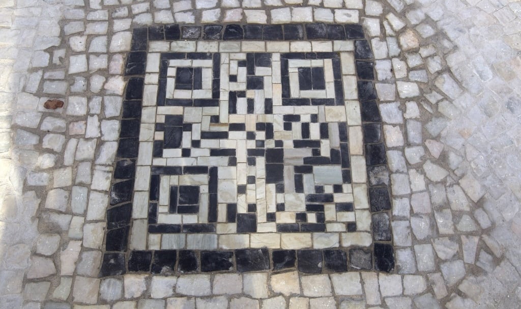 QR codes made of the black and white stones covers a sidewalk near the beach in Rio de Janeiro, Brazil, Friday, Jan. 25, 2013. The QR codes are being placed at tourist spots which can be scanned with a mobile device for information about the site. 