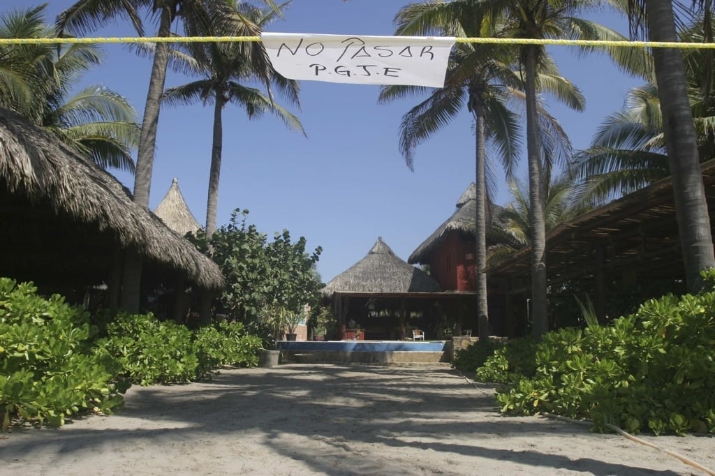 A sign reading "No crossing, P.G.J.E."(Attorney General of the State) hangs from a string to cordon off a crime scene at a beach hotel, where six female Spanish tourists were raped by armed men, in Acapulco February 5, 2013. 