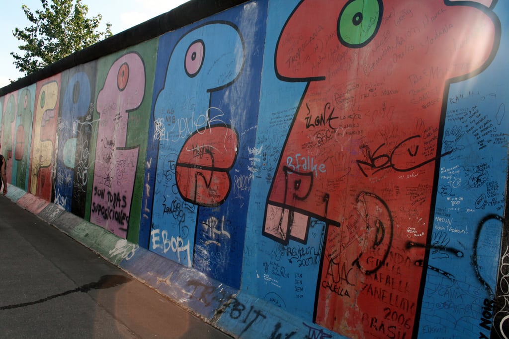 This section of the wall with the famous colorful "heads with big lips" painting by French artist Theirry Noir would be removed for the flats. 