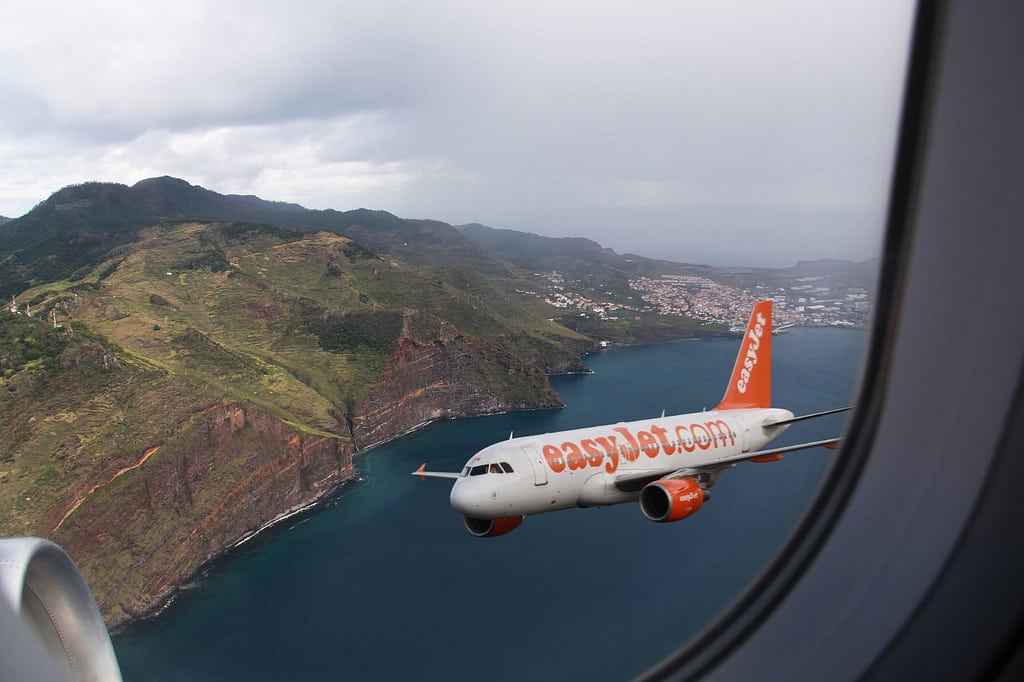 An EasyJet airplane seen from another airplane off the coast of Madeira. 