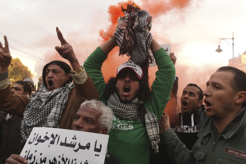 Protesters chant anti-Mursi slogans during a protest in front of the presidential palace in Cairo, February 1, 2013. 