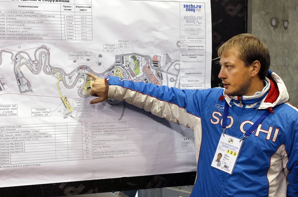 Anton Polyakov, the venue manager, points out a map of the track at the Sliding Center Sanki, home of Luge, Bobsleigh and Skeleton for the Sochi 2014 Olympic games. 