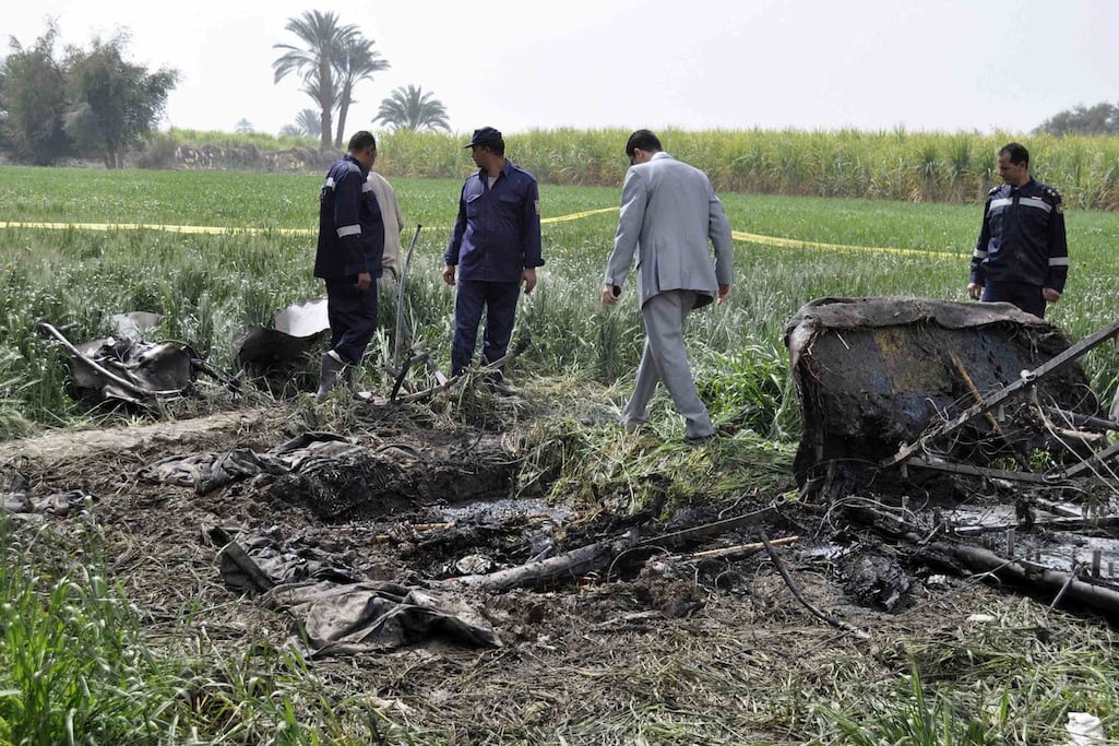 Police and rescue officials check the wreckage of a hot air balloon that crashed in Luxor February 26, 2013. 