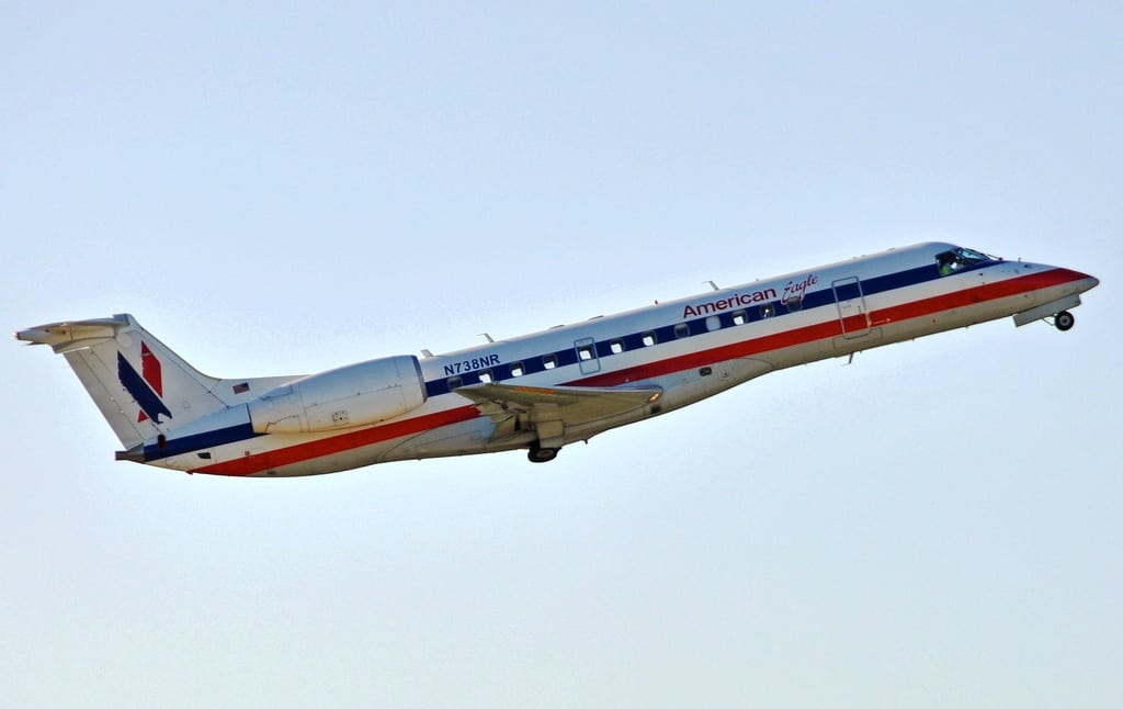 An airborne American Eagle Embraer ERJ-135LR. 